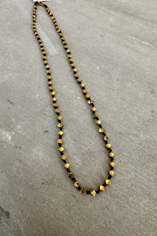 Gold short necklace with black string