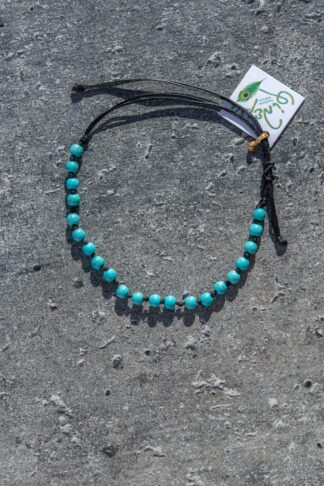Adjustable bracelet with light blue color beads